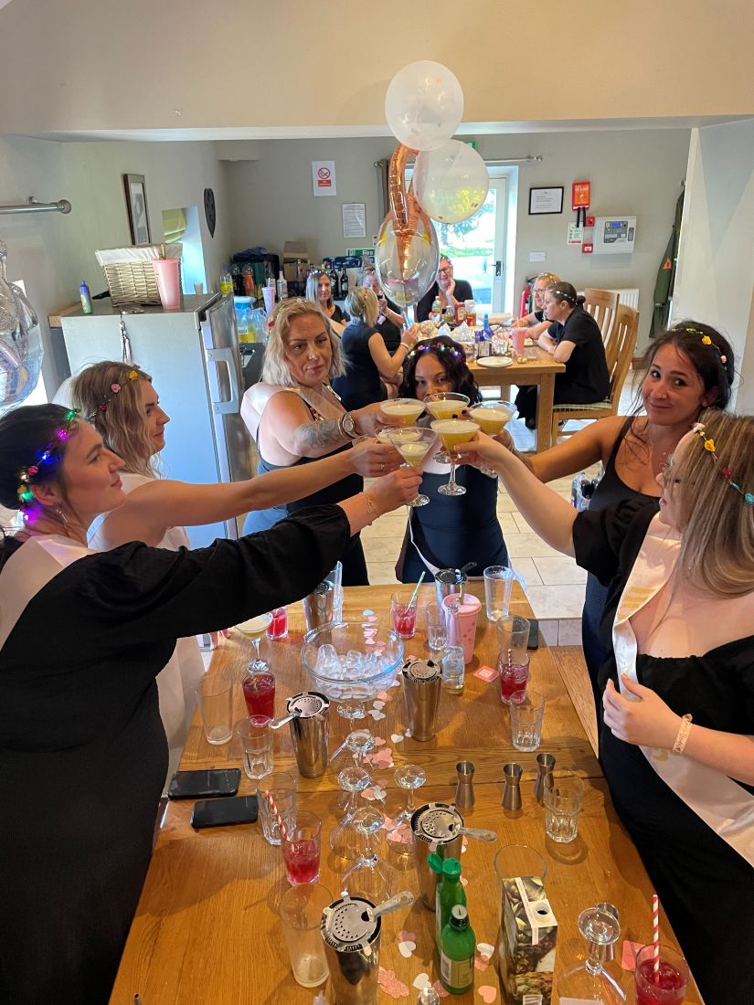 Guests toasting the cocktails they have just made