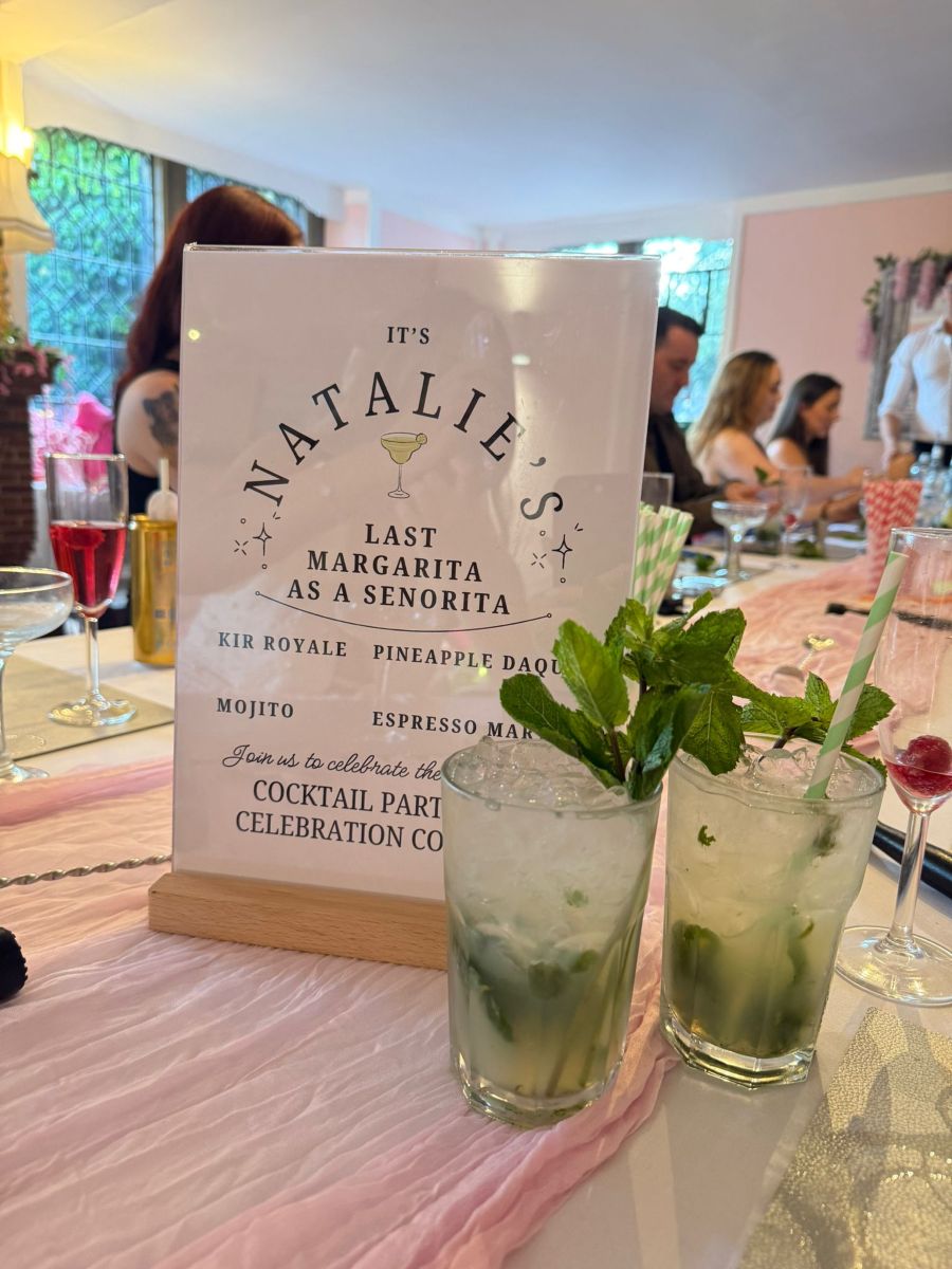 Two mojitos beside a personalised hen party cocktail menu